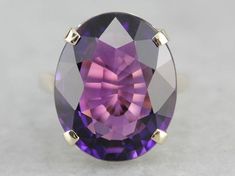 "This ring is truly gorgeous! A large and beautiful purple Amethyst sits in the center, with an amazing cut and vibrant purple color that flickers with hints of violet and raspberry, a simple yellow gold mounting and four prongs are all this stone needs to frame it to perfection! Metal: 14K Yellow Gold Gem: Amethyst 15.00 Carats Gem Measurements: 19 x 15.6 mm, Oval Ring Size: 8 Marks: \"14K WNG\" Stamped on the inside band SKU #: DW7441NA-D Each piece has been identified and graded by a Graduate Rose Gold Oval Engagement Ring, Amethyst Cocktail Ring, Right Hand Ring, Leaf Engagement Ring, White Gold Diamond Engagement Ring, Topaz Engagement Ring, Right Hand Rings, Hand Ring, Vibrant Purple