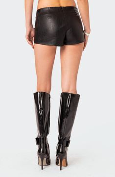 Date night is calling in these laced-up shorts crafted from sleek faux leather. Lace-up closure; hidden back-zip closure 100% polyester with polyurethane coating Hand wash, dry flat Imported Edgy Black Faux Leather Shorts, Faux Leather Bottoms With Belt Loops, Short Length, Faux Leather Shorts With Belt Loops, Edgy High-waisted Faux Leather Shorts, Edgy Leather Shorts For Spring, Edgy Short Leather Bottoms, Edgy Black Leather Shorts, Black Leather Edgy Shorts, Fall Shorts With Zipper Closure