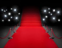 a red carpeted staircase leading up to some stairs with white lights on them and black background