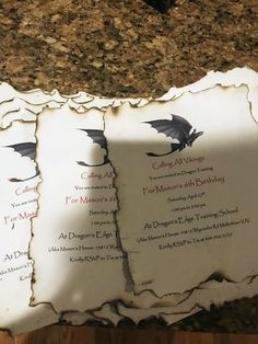 two pieces of paper that have been torn apart on a counter top with the names and date