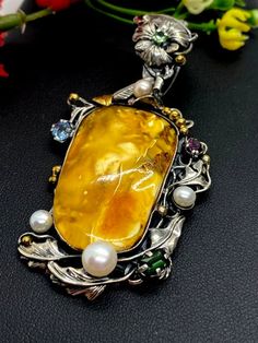 "ARTISAN AMBER GEMSTONE PENDANT Hand-made Sterling Silver 925. 24k Gold Stones used: Butterscotch Baltic Amber Pink&Green Tourmaline, Pearls Height - 2 3/4' (with bail), Width - 1 3/8' Height -70mm (with bail), Width - 35mm Unique Handcrafted One-of a-kind Design Pendant Each Piece of Jewelry in my Collection is Absolutely One of a Kind! When you start wearing a piece of my jewelry you will fall in love with it more and more each day and feel that good Energy and Love that I pass into it whi Luxury Yellow Multi-stone Jewelry, Luxury Handmade Amber Necklace, Luxury Amber Jewelry With Polished Finish, Elegant Yellow Cabochon Necklace, Yellow Polished Pendant Jewelry, Yellow Pendant Jewelry With Polished Finish, Elegant Amber Rectangular Pendant Jewelry, Luxury Citrine Cabochon Jewelry, Luxury Yellow Cabochon Jewelry