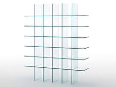 an empty glass shelf with several shelves on each side and one in the middle, against a white background