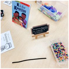 the table is covered with different kinds of beads and other items to make it easier for children to learn