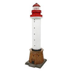 a red and white lighthouse on top of a brick base