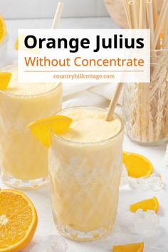 two glasses filled with orange juice and garnished with straws on the table