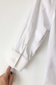 Celine White Tuxedo Shirt. White elbow sleeve tuxedo shirt with contrast pique woven bib and cuffs. Has pleat detail at sleeves. 100% Cotton, dry clean only. Marked as size 34, fits XS. Imported. Approx. Measurements: Underarm to Underarm: 17" Length: 22" Tuxedo Shirt, White Tuxedo, Tuxedo Shirts, Elbow Sleeve, Shirt White, Dry Clean, White