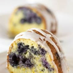 a blueberry bundt cake with icing on a plate