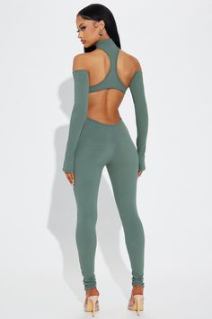 Available In Olive 2. Jumpsuit Mock Neck Keyhole Detail Cut Out Detail Racerback Open Back Sleeve Set Thumb Hole Stretch Compression Rib 86% Polyester 14% Spandex Imported | Nia Snatched Jumpsuit in Olive 2 size XS by Fashion Nova