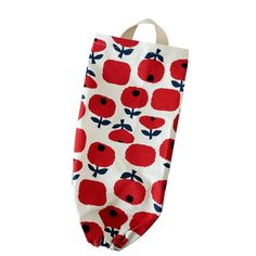 an oven mitt with red flowers on it