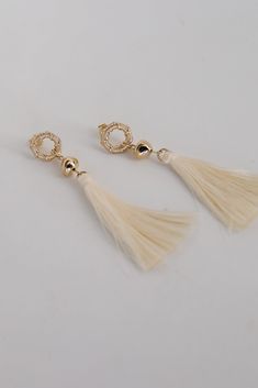 The Gracelyn Gold Tassel Earrings are the hit of the party! These trendy earrings start with a stud post back and have a tassel detail. Add these fun earrings to a black dress + heels to add a chic touch to your date night look! Gold Plated Tassels Stud Post Back One Size | Length 3” Elegant Beaded Tassel Earrings, Chic Summer Tassel Earrings For Party, Elegant Summer Tassel Earrings, Elegant Tassel Drop Earrings For Summer, Chic Tassel Earrings For Evening, Elegant Summer Tassel Drop Earrings, Elegant Summer Jewelry With Tassels, Chic Summer Jewelry With Tassels, Spring Trendy Tassel Earrings