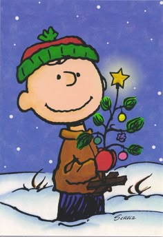 a charlie brown christmas card with a small tree in the snow and stars on it