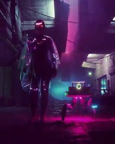 a man standing in the middle of a dark alley with neon lights on his face