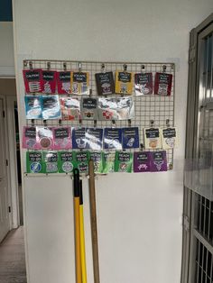 there is a rack with several items on it and a baseball bat in the foreground