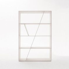 a white book shelf sitting on top of a floor