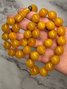 113 Grams Antique Bakelite  Rosary Prayer Beads Marbled. Very quality Beads, small holes. All beads are marbled. 33 total bead plus imam.  Size beads : 17 mm x 15.50 mm,  Imam size : 33 mm x 14 mm. For any question feel free to ask. Large Round Amber Beads And Cabochons, Round Amber Polished Beads Gems And Cabochons, 8mm Amber Beads For Jewelry Making, Amber 8mm Beads For Jewelry Making, Round Amber Beads For Jewelry Making, Bakelite Jewelry, Rosary Prayer, Wishful Thinking, Prayer Beads