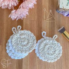 crocheted doily and other crafting supplies laid out on a wooden surface