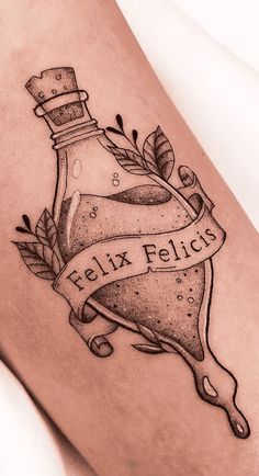 a black and white photo of a tattoo with the words fix felicis on it