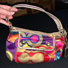 This Super Cute Vibrant Coach Purse Is A Must Have! It Will Definitely Spice Up Any Outfit With A Pop Of Color! Gold Detailing Throughout. Soo Beautiful. I Wore This A Couple Times For Evenings Out. Bags Colorful, Coach Purse, Coach Purses, Gold Details, Purple Gold, Spice Up, Coach Bags, Spice Things Up, Pop Of Color