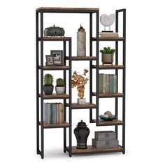 a book shelf with books, vases and other items on top of it in front of a white background