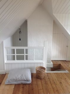 a bathroom with wood walls and white trim on the wall, along with a window