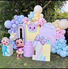 an outdoor birthday party with balloons and decorations