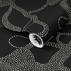 a black and white wallpaper with circles on it