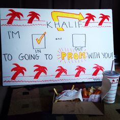 a sign that says i'm going to prom with you next to some food