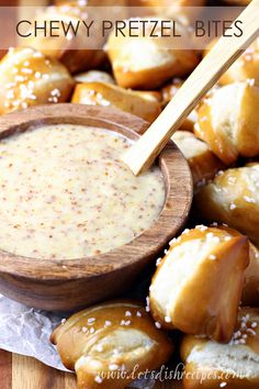 cheesy pretzel bites with dipping sauce in a wooden bowl