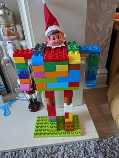 an elf is standing in front of a lego toy