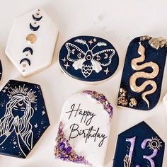 decorated cookies are arranged in the shape of zodiac signs