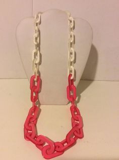 "Gorgeous pink and white long chunky resin link necklace. 40\" total length." Pink Chunky Chain Link Necklace, Trendy White Link Necklace, Trendy White Link Necklaces, Pink Chunky Chain Link Jewelry, Pink Chunky Chain Necklace, Pink Chunky Link Chain Jewelry, Trendy White Chunky Chain Necklace, White Resin Necklaces, White Chunky Link Chain Necklaces