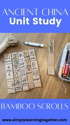 an ancient china unit study with bamboo scroll markers and crayons on the table