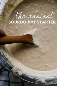 a pan filled with batter and a wooden spoon in it that says the easyest sourdough starter