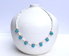 This lovely beaded necklace consists of mini natural howlite stones (white) that have been embellished with turquoise howlite teardrop beads, and rose gold accents. So pretty, so feminine, and can also come with silver or gold accents if preferred.  MATERIALS: ▪️ Natural Howlite 4mm beads ▪️ Howlite (blue) teardrop beads ▪️ Accents - choice between gold plated, rose gold plated, or silver plated beading DIMENSION: Necklace Length - 45cm *Please contact me if you require a different length Beaded Howlite Necklaces With Round Beads, Howlite Gemstone Beads Necklace, Adjustable Howlite Gemstone Bead Necklace, White Turquoise Gemstone Beads Necklace For Gifts, White Turquoise Necklace With Gemstone Beads For Gifts, White Turquoise Necklace With Gemstone Beads As Gift, White Natural Stone Necklace For Gift, Howlite Beaded Necklaces With Round Beads For Gifts, Howlite Beaded Necklaces With Round Beads As Gift