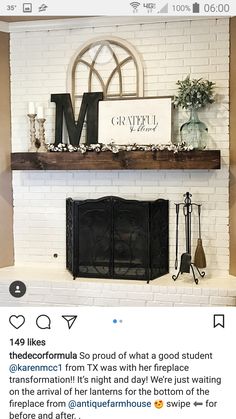 the fireplace is decorated with white brick and wood