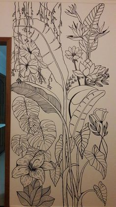 a black and white drawing on the wall of a room with flowers, leaves and plants