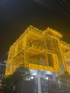 a building with lights on the side of it