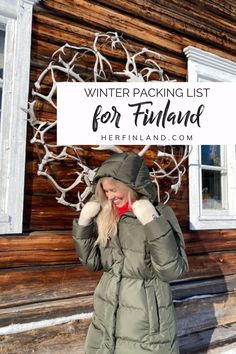 a woman standing in front of a log cabin with the text winter packing list for finland