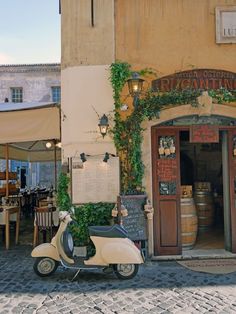 a scooter is parked in front of a restaurant