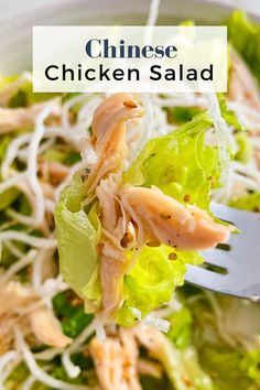 chicken salad with lettuce and shredded cheese in a white bowl