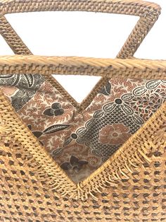 Handwoven Natural Rattan Olivia Tote Woven by talented women artisans in Bali and sustainably sourced with care. Materials: 100% handwoven RattanDimensions: Unlined Tote: Total bag height from bottom to handle top: 12", bag body dimensions: 8"H x 5"W x 12"L, Handle triangle dimensions: 7"L x 5 3/4"HLined Tote: Total bag height from bottom to handle top: 10 3/4", bag body dimensions: 8"H x 5"W x 10 3/4, Handle triangle dimensions: 7"L x 5 1/2"H Artisan Woven Beige Straw Bag, Artisan Beige Woven Straw Bag, Open Weave Basket Shoulder Bag For Market, Brown Basket Beach Bag With Open Weave, Brown Open Weave Straw Bag For Market, Brown Open Weave Basket Beach Bag, Eco-friendly Brown Open Weave Straw Bag, Brown Open Weave Beach Bag Made Of Natural Fiber, Brown Open Weave Beach Bag In Natural Fiber