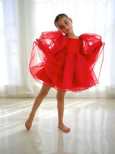 You can't ever go wrong with a classic bright Christmas red babydoll dress for your little one for the holidays. This babydoll dress features a round neckline with long puff sleeves, but can also be styled to the elbow. It has the perfect tie back bow. Babydoll length skirt is accented by 2 organza layers & satin lining. She will be flooded with compliments in our gorgeous Jovie dress dress. COMPOSITION OUTER SHELL ORGANZA LINED UNDERNEATH WITH SATIN. Dresses sizes 6 months to 5 years will have Red Long Sleeve Holiday Dress For Dress-up Occasions, Red Long Sleeve Holiday Dress For Dress-up, Red Long Sleeve Holiday Dress With Ruffles, Red Long Sleeve Princess Dress For Festive Occasions, Festive Red Long Sleeve Princess Dress, Red Puff Sleeve Party Dress, Red Babydoll Dress, Bright Christmas, Long Puff Sleeves