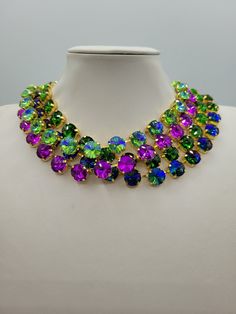 These Anna Wintour style statement necklaces are made with beautiful rivoli crystals in a range of colours, there is 12mm Grass Green AB, 12mm Peridot AB, 12mm Purple and 12mm Grass Green. The crystals are accentuated beautifully with the gold yellow setting. You can wear them separately or layer them all together for full impact,  sure to get compliments and attention. Their versatility makes them perfect for parties and other celebratory gatherings. Quality of the stones and settings makes them a perfect candidate for becoming heirloom pieces. It is elegant, classy and very "Anna Wintour style". Each necklace is accompanied by a pair of coordinated "FREE GIFT" earrings. - Crystals - 12mm Rivoli point back strass. - Crystal Colour - Grass Green AB. - Necklace setting - Gold plated Brass ( Anna Wintour Style, Necklace Gold Jewelry, Gold Schmuck, Statement Necklace Gold, Creative Accessories, Rainbow Sapphires, Necklace Swarovski, Heidi Daus, Sparkle Necklace