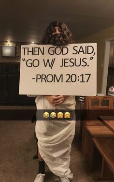 a man holding a sign that says, then god said go w / jesus prom