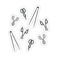 black and white stickers with scissors drawn on them, all in the same pattern