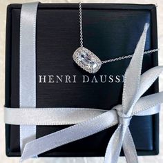 Make a luxurious statement with this Henri Daussi Designer Signed 0.82ct t.w. diamond cushion brilliant cut halo east-west set solitaire pendant necklace. This exquisite piece features an exquisitely cut 0.70ct center diamond, accompanied by a halo of smaller diamonds to create a truly stunning look. Delight in the beauty of luxury and unsurpassed craftsmanship with this gorgeous necklace.Metal: 18K Yellow GoldDiamond Shape: Cushion Brilliant CutDiamond Weight: Cushion Center Shape 0.70ct tw 20 Henri Daussi, White Gold Pendant Necklace, Solitaire Setting, Solitaire Pendant Necklace, Solitaire Pendant, East West, Diamond Pendant Necklace, Rose Gold Necklace, Diamond Pendant