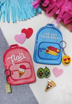 the back to school items are laid out next to each other, including a backpack and some tassels