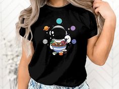 This ASTRO RAMEN Shirt is the perfect gift! 📦 🎉  👕 PRODUCT DETAILS 👕 Crew neck Unisex Fit 100% High-quality Cotton this 3001 unisex jersey short sleeve tee fits like a well-loved favorite. Soft cotton and quality print make users fall in love with it over and over again. These t-shirts have-ribbed knit collars to bolster shaping. The shoulders have taping for better fit over time. Dual side seams hold the garment's shape for longer.  .: 100% Airlume combed and ringspun cotton (fiber content may vary for different colors) .: Light fabric (4.2 oz/yd² (142 g/m .: Retail fit .: Tear away label .: Runs true to size 📏 SIZING 📏 See size table in gallery for exact measurements. 💡 HOW TO ORDER Step 1: Select your shirt - Style/ Size Example: shirt- XL Step 2: Select your shirt - Color Exampl Ramen Gifts, Ramen Shirt, Food Shirt, Foodie Gifts, Gift Product, Cotton Fiber, Ramen, Gift For Lover, San Jose