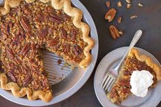 a pecan pie on a plate with a slice taken out of it and another pie in the background