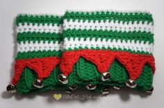 two green and white crocheted christmas napkins with bells on each one side